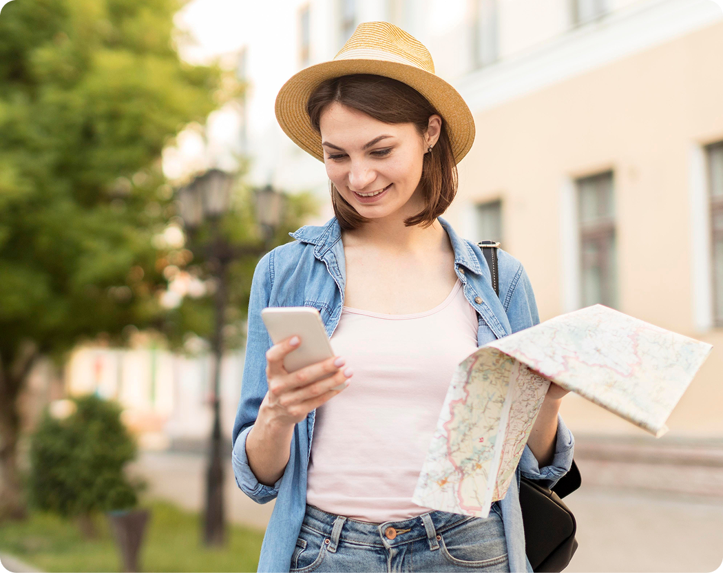 Woman exploring with phone and map
